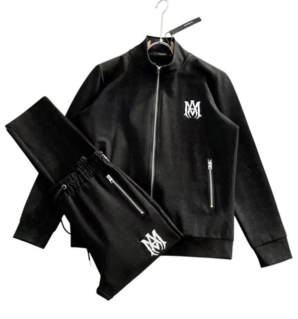 Completo Amiri con giacca track e pantaloni neri con logo