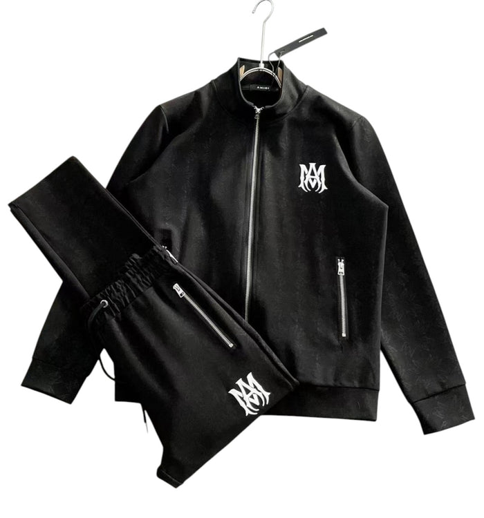 Completo Amiri con giacca track e pantaloni neri con logo