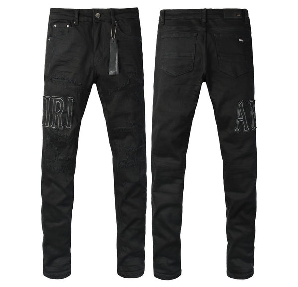 1. Jeans neri effetto vissuto con patch logo Amiri