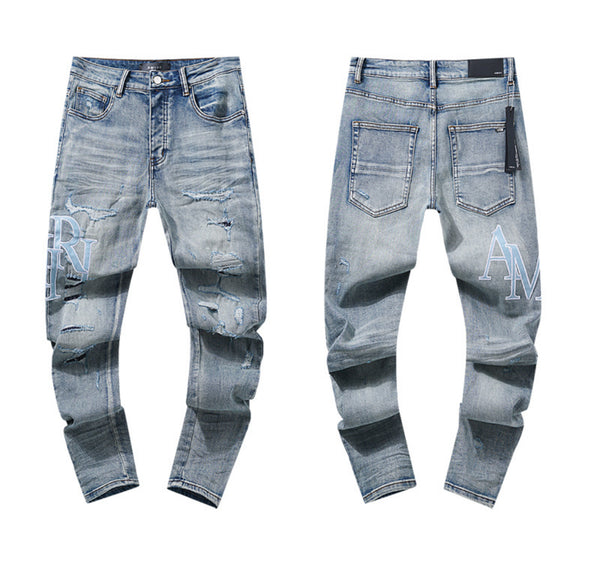 Jeans skinny effetto usurato con logo Amiri – lavaggio chiaro