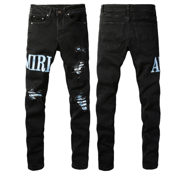 Jeans Amiri neri slavati con logo azzurro chiaro distressed