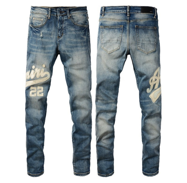 Jeans grigi Amiri con grafica effetto distressed